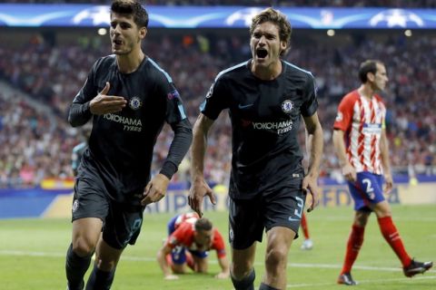 Chelsea's scorer Alvaro Morata, left, and his teammate Marcos Alonso, right, celebrate their side's first goal during a Champions League group C soccer match between Atletico Madrid and Chelsea at the Wanda Metropolitano stadium in Madrid, Spain, Wednesday, Sept. 27, 2017. (AP Photo/Francisco Seco)