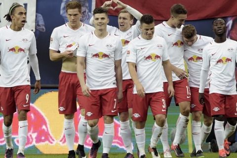 Leipzig players celebrate after scoring during the German first division Bundesliga soccer match between RB Leipzig and 1. FSV Mainz 05 in Leipzig, Germany, Sunday, Nov. 6, 2016. (AP Photo/Jens Meyer)