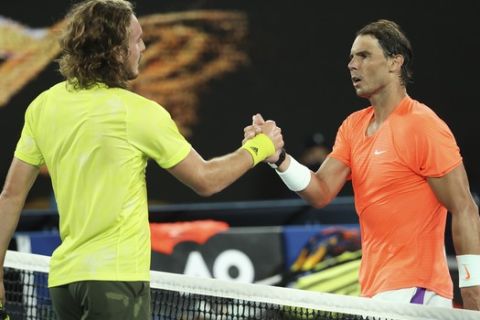 Greece's Stefanos Tsitsipas, left, is congratulated by Spain's Rafael Nadal after winning their quarterfinal match at the Australian Open tennis championship in Melbourne, Australia, Wednesday, Feb. 17, 2021..(AP Photo/Hamish Blair)
