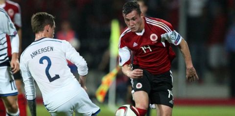 Albania's Taulant Xhaka (R) vies for the ball with Denmark's Peter Ankersen (L) during the Euro 2016 qualifying round football match between Albania and Denmark at the Elbasan Arena Stadium, on October 11, 2014 in Elbasan. AFP PHOTO / GENT SHKULLAKU        (Photo credit should read GENT SHKULLAKU/AFP/Getty Images)