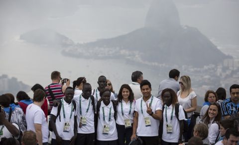 Members of the Refugee Olympic Team pose for a photo with the Sugar Loaf mountain in the background in Rio de Janeiro, Brazil, Saturday, July 30, 2016. A group of 10 athletes from South Sudan, Syria, Congo and Ethiopia will compete in Rio under the Olympic flag. (AP Photo/Felipe Dana)