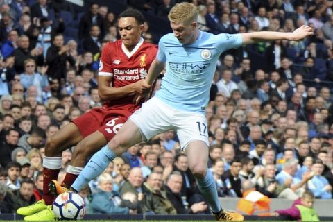 Liverpool's Trent Alexander-Arnold, left, and Manchester City's Kevin De Bruyne, right, challenge for the ball during the English Premier League soccer match between Manchester City and Liverpool at the Etihad Stadium in Manchester, England, Saturday, Sept. 9, 2017. (AP Photo/Rui Vieira)