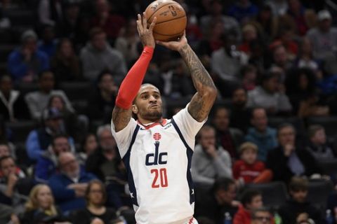 Washington Wizards guard Gary Payton II (20) shoots during the second half of an NBA basketball game against the Detroit Pistons, Monday, Jan. 20, 2020, in Washington. The Wizards won 106-100. (AP Photo/Nick Wass)