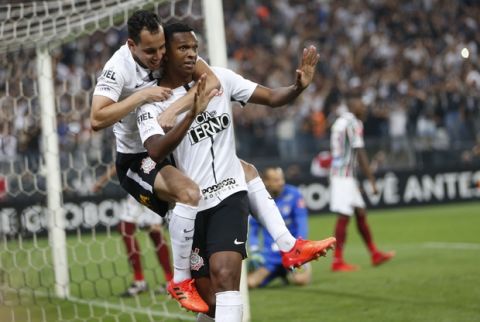 Corinthians' Jo, front, celebrates his goal with teammate Rodriguinho during a Brasileirao championship soccer match with Fluminense in Sao Paulo, Brazil, Wednesday, Nov. 15, 2017. (AP Photo/Andre Penner)