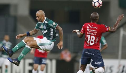 Felipe Melo, of Brazil's Palmeiras, left, fights for the ball with Luis Cabezas, of Bolivia's Jorge Wilstermann, during a Copa Libertadores soccer match in Sao Paulo, Brazil, Wednesday, March 15, 2017. (AP Photo/Nelson Antoine)