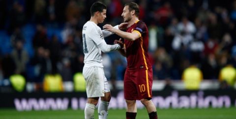 "MADRID, SPAIN - MARCH 08: James Rodriguez of Real Madrid shakes hands with Francesco Totti of Roma after the UEFA Champions League Round of 16 Second Leg match between Real Madrid and Roma at Estadio Santiago Bernabeu on March 8, 2016 in Madrid, Spain.  (Photo by Gonzalo Arroyo Moreno/Getty Images)"
