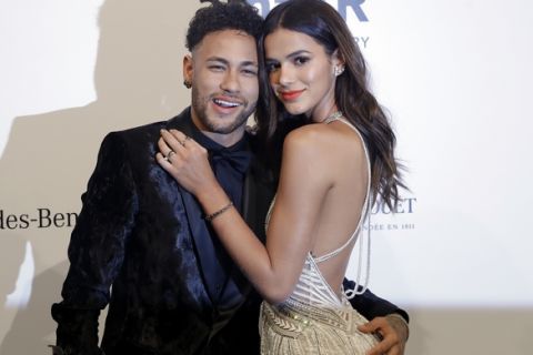 Brazilian soccer player Neymar and his girlfriend Bruna Marquesine pose on the red carpet of The Foundation for AIDS Research (amfAR) event in Sao Paulo, Brazil, Friday, April 13, 2018. (AP Photo/Andre Penner)