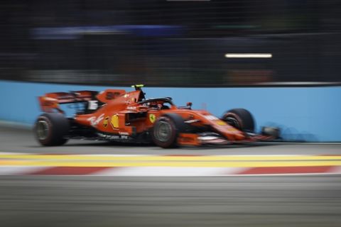Ferrari driver Charles Leclerc of Monaco steers his car during the qualifying round for the Singapore Formula One Grand Prix at the Marina Bay City Circuit in Singapore, Saturday, Sept. 21, 2019. (AP Photo/Vincent Thian)