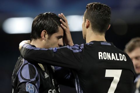 Real Madrid's Alvaro Morata, left, celebrates with Cristiano Ronaldo after scoring his side's third goal during the Champions League round of 16, second leg, soccer match between Napoli and Real Madrid at the San Paolo stadium in Naples, Italy, Tuesday March 7, 2017. (AP Photo/Andrew Medichini)