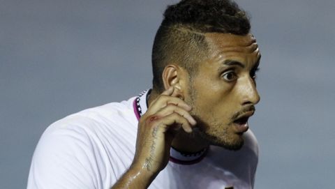 Australia's Nick Kyrgios puts his finger to his ear as he interacts with the crowd during his Mexican Tennis Open semifinal match against John Isner of the U.S. in Acapulco, Mexico, Friday, March 1, 2019. (AP Photo/Rebecca Blackwell)