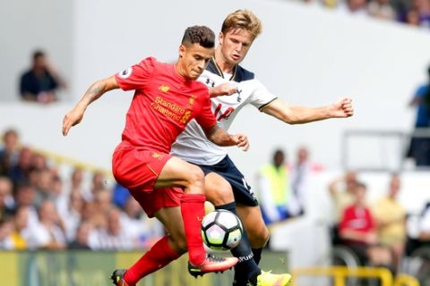 Liverpool's Philippe Coutinho, left, competes for the ball with Tottenham's Eric Dier during the English Premier League soccer match between Tottenham Hotspur and Liverpool at White Hart Lane in London, Saturday, Aug. 27, 2016. (AP Photo/Tim Ireland)