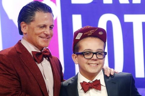 Cleveland Cavaliers owner Dan Gilbert poses with his son Nick Gilbert after winning the NBA basketball draft lottery, Tuesday, May 21, 2013 in New York. (AP Photo/Jason DeCrow)