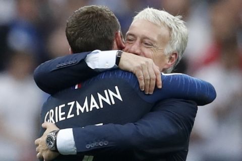 France head coach Didier Deschamps hugs Antoine Griezmann at the end of the final match between France and Croatia at the 2018 soccer World Cup in the Luzhniki Stadium in Moscow, Russia, Sunday, July 15, 2018. France won 4-2. (AP Photo/Petr David Josek)