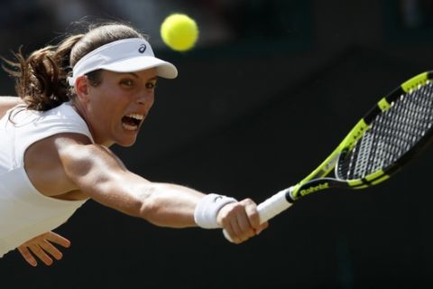 Britain's Johanna Konta returns to Greece's Maria Sakkari during their Men's Singles Match on day five at the Wimbledon Tennis Championships in London Friday, July 7, 2017. (AP Photo/Kirsty Wigglesworth)
