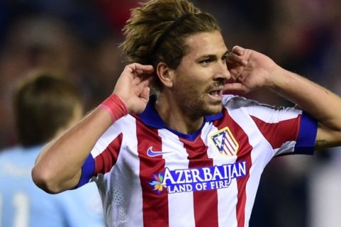 Atletico Madrid's Italian midfielder Alessio Cerci celebrates after scoring their fifth goal during the UEFA Champions League football match Club Atletico de Madrid vs Malmo FF at the Vicente Calderon stadium in Madrid on October 22, 2014.   AFP PHOTO/ JAVIER SORIANO        (Photo credit should read JAVIER SORIANO/AFP/Getty Images)