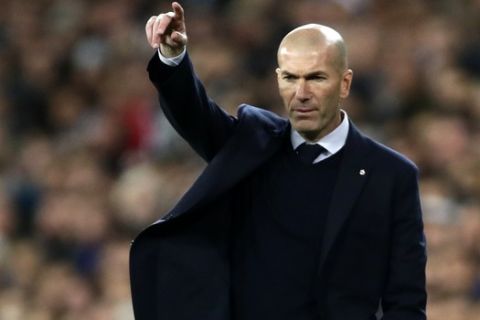 Real Madrid's head coach Zinedine Zidane gives instructions to his players during the Champions League, round of 16, first leg soccer match between Real Madrid and Manchester City at the Santiago Bernabeu stadium in Madrid, Spain, Wednesday, Feb. 26, 2020. (AP Photo/Manu Fernandez)
