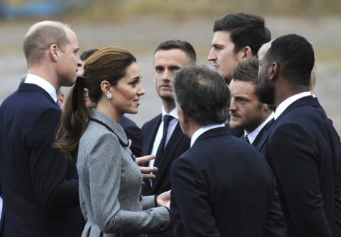 Britain's Prince William and Kate, Duchess and Duke of Cambridge, left, meet Leicester City players during a visit to pay tribute to those who were tragically killed in a helicopter crash, at Leicester City Football Club's King Power Stadium in Leicester, England, Wednesday, Nov. 28, 2018. Vichai Srivaddhanaprabha, the Thai billionaire owner of Premier League team Leicester City was among five people who died after his helicopter crashed and burst into flames shortly after taking off from the soccer field on Saturday Oct. 27, 2018. (AP Photo/Rui Vieira)
