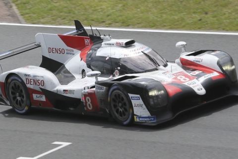 The Toyota TS050 Hybrid No8 of the Toyota Gazoo Racing Team driven by Sebastien Buemi of Switzerland, Kazuki Nakajima of Japan and Fernando Alonso of Spain in action during the last lap of the 87th 24-hour Le Mans endurance race, in Le Mans, western France, Sunday, June 16, 2019. (AP Photo/David Vincent)