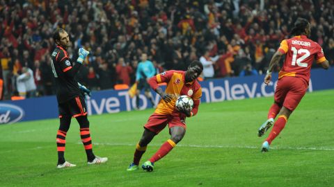Galatasaray players celebrate their first goal against Real Madrid on April 9, 2013 during a UEFA Champions League quarter-final, second leg football match at the Ali Sami Yen stadium in Istanbul.   AFP PHOTO / BULENT KILIC        (Photo credit should read BULENT KILIC/AFP/Getty Images)