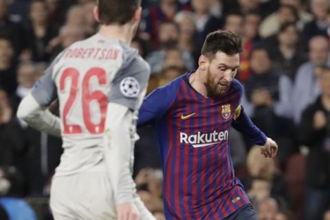 Barcelona's Lionel Messi, right, plays the ball past Liverpool's Andy Robertson, second right, Liverpool's Jordan Henderson, second left, and Liverpool's Sadio Mane during the Champions League semifinal, first leg, soccer match between FC Barcelona and Liverpool at the Camp Nou stadium in Barcelona, Spain, Wednesday, May 1, 2019. (AP Photo/Emilio Morenatti)