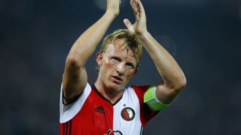 In this Sept. 15m 2016 file photo Feyenoord's team captain Dirk Kuyt applauds the supporters at the end of the Group A Europa League match between Feyenoord and Manchester United at the De Kuip stadium in Rotterdam, Netherlands. Veteran captain Dirk Kuyt scored a hat trick Sunday May 14, 2017, as Feyenoord beat Heracles Almelo 3-1 to win its 15th Dutch Eredivisie title and the first in 18 long years for its fervent fans. Kuyt returned to Feyenoord in the twilight of his career saying he wanted to lead the team to the Dutch championship and scored his 100th goal for the club in the first minute to settle nerves throughout Rotterdam. (AP Photo/Peter Dejong)