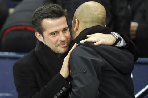 Watford's manager Marco Silva, left, greets Manchester City's manager Pep Guardiola ahead of the English Premier League soccer match between Manchester City and Watford at Etihad stadium, in Manchester, England, Tuesday, Jan. 2, 2018. (AP Photo/Rui Vieira)