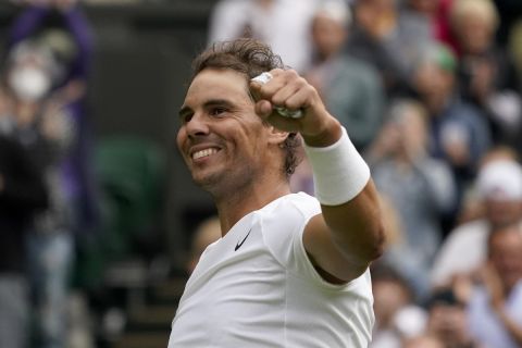 Spain's Rafael Nadal celebrates after winning against Argentina's Francisco Cerundolo in a first round men's singles match on day two of the Wimbledon tennis championships in London, Tuesday, June 28, 2022. (AP Photo/Alberto Pezzali)
