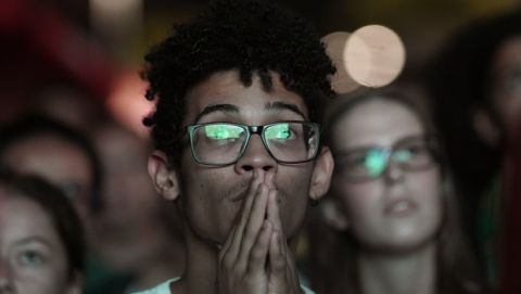 Brazil soccer fans watch their team's Copa America semifinal soccer match against Argentina at an outdoor, live broadcast of the game in Rio de Janeiro, Brazil, Tuesday, July 2, 2019. (AP Photo/Leo Correa)