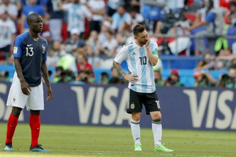 Argentina's Lionel Messi, right, reacts next to France's Ngolo Kante, left, during the round of 16 match between France and Argentina, at the 2018 soccer World Cup at the Kazan Arena in Kazan, Russia, Thursday, June 28, 2018. (AP Photo/Ricardo Mazalan)