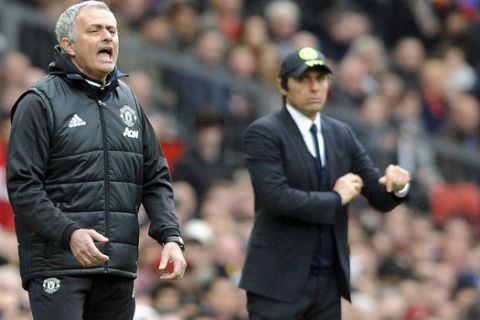 FILE - In this Sunday, April 16, 2017 file photo, Manchester United's team manager Jose Mourinho, left, and Chelsea's team manager Antonio Conte react during the English Premier League soccer match between Manchester United and Chelsea at Old Trafford stadium in Manchester. The feud between Conte and Mourinho has intensified. Tensions were already simmering after two days of back-and-forth between the pair in news conferences. After Chelseas draw at Norwich in the FA Cup, Conte called Mourinho a "little man" and "fake" before issuing an apparent challenge to the United manager. (AP Photo/ Rui Vieira, File)