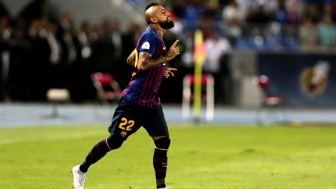 Barcelona's Arturo Vidal gestures during the Spanish Super Cup soccer match between Sevilla and Barcelona in Tangier, Morocco, Sunday, Aug. 12, 2018. (AP Photo/Mosa'ab Elshamy)