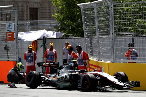 BAKU, AZERBAIJAN - JUNE 18: Sergio Perez of Mexico and Force India looks at his car after crashing at the end of final practice before the European Formula One Grand Prix at Baku City Circuit on June 18, 2016 in Baku, Azerbaijan.  (Photo by Mark Thompson/Getty Images)