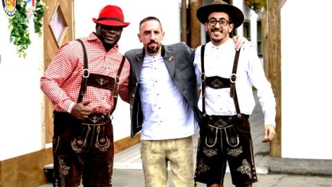Franck Ribery, center, player of the German first division, Bundeliga, soccer team FC Bayern Munich, and and two unidentified men arrive at the 'Oktoberfest' beer festival in Munich, Germany, Sunday, Oct. 7, 2018. (Matthias Balk/dpa via AP)