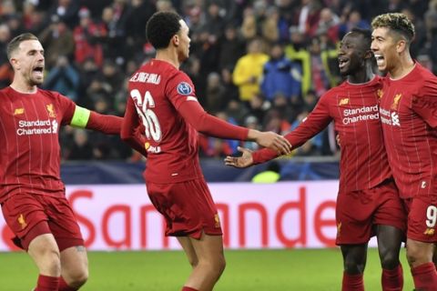 Liverpool's Naby Keita, second right, celebrates after scoring his side's opening goal during the group E Champions League soccer match between Salzburg and Liverpool, in Salzburg, Austria, Tuesday, Dec. 10, 2019. (AP Photo/Kerstin Joensson)