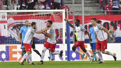 Salzburg's players celebrate after scoring during the Europa League group I soccer match between FC Salzburg and Olympique Marseille in the Arena in Salzburg, Austria, Thursday, Sept. 28, 2017. (AP Photo/Kerstin Joensson)