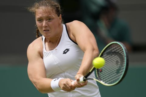 Germany's Jule Niemeier returns the ball to Estonia's Anett Kontaveit during their singles tennis match on day three of the Wimbledon tennis championships in London, Wednesday, June 29, 2022. (AP Photo/Kirsty Wigglesworth)