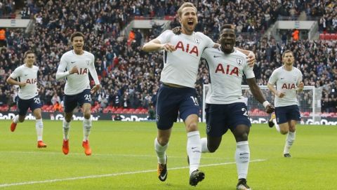 Tottenham's Harry Kane, center, celebrates after scoring his side's first goal during the English Premier League soccer match between Tottenham Hotspur and Liverpool at Wembley Stadium in London, Sunday, Oct. 22, 2017. Tottenham won by 4-1. (AP Photo/Frank Augstein)