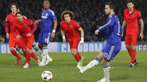Chelsea's Belgian midfielder Eden Hazard (2nd R) scores his team's second goal from a penalty during the UEFA Champions League round of 16 second leg football match between Chelsea and Paris Saint-Germain at Stamford Bridge in London on March 11, 2015.  AFP PHOTO / IAN KINGTON        (Photo credit should read IAN KINGTON/AFP/Getty Images)