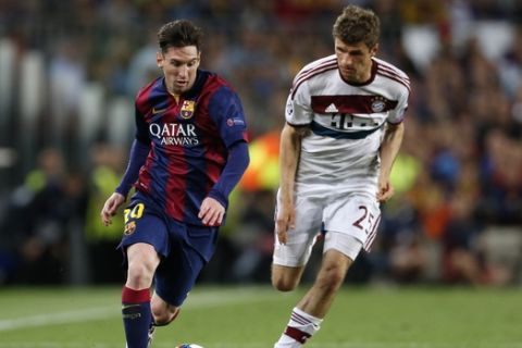 Barcelona's Lionel Messi, left, is followed by Bayern's Thomas Mueller as he goes downfield during the Champions League semifinal first leg soccer match between Barcelona and Bayern Munich at the Camp Nou stadium in Barcelona, Spain, Wednesday, May 6, 2015.  (AP Photo/Manu Fernandez)