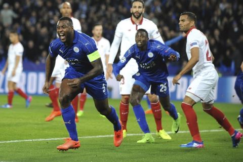 Leicester's Wes Morgan, left, celebrates after he scores a goal during the Champions League round of 16 second leg soccer match between Leicester City and Sevilla at the King Power Stadium in Leicester, England, Tuesday, March 14, 2017. (AP Photo/Rui Vieira)
