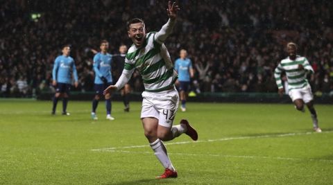 Celtic's Callum McGregor celebrates scoring his side's first goal of the game during their Europa League round of 32, first leg soccer match against Zenit St Petersburg at Celtic Park, Glasgow, Scotland, Thursday, Feb. 15, 2018. (Andrew Milligan/PA via AP)