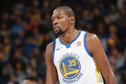 OAKLAND, CA - DECEMBER 11:   Kevin Durant #35 of the Golden State Warriors looks on during the game against the Portland Trail Blazers on December 11, 2017 at ORACLE Arena in Oakland, California. NOTE TO USER: User expressly acknowledges and agrees that, by downloading and or using this photograph, user is consenting to the terms and conditions of Getty Images License Agreement. Mandatory Copyright Notice: Copyright 2017 NBAE (Photo by Noah Graham/NBAE via Getty Images)