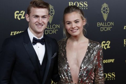 Juventus' Matthijs de Ligt and his girlfriend AnneKee Molenaar pose during the Golden Ball award ceremony at the Grand Palais in Paris, Monday, Dec. 2, 2019. Awarded every year by France Football magazine since Stanley Matthews won it in 1956, the Ballon d'Or, Golden Ball for the best player of the year will be given to both a woman and a man. (AP Photo/Francois Mori)