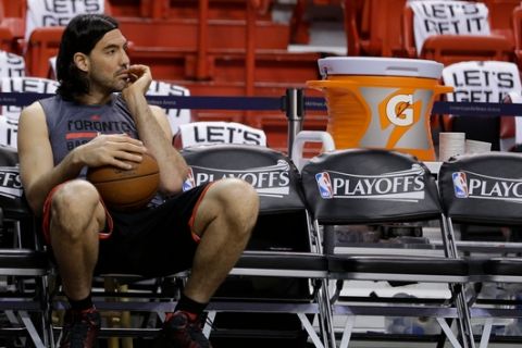 Toronto Raptors' Luis Scola relaxes at warm ups before Game 6 of the NBA basketball Eastern Conference semifinals against the Miami Heat, Friday, May 13, 2016, in Miami. (AP Photo/Alan Diaz)