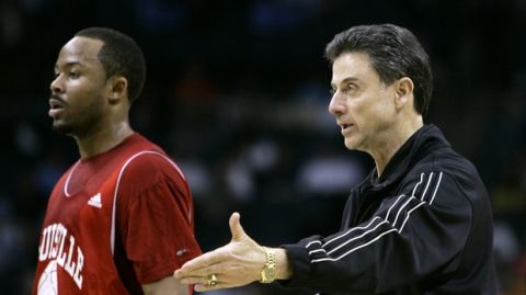 Louisville head coach Rick Pitino directs his team as guard Jerry Smith, left, looks on during basketball practice at the NCAA East Regional, Wednesday, March 26, 2008, in Charlotte. Louisville plays Tennessee on Thursday. (AP Photo/Chuck Burton) 