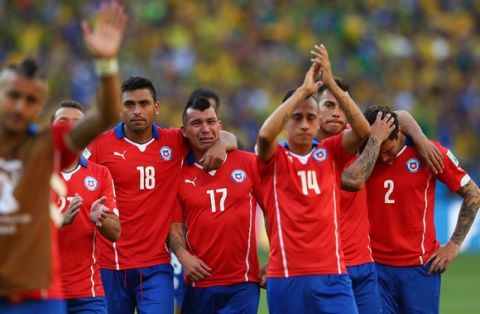 BELO HORIZONTE, BRAZIL - JUNE 28: (L-R) Gonzalo Jara, Gary Medell, Fabian Orellana, Eduardo Vargas and Eugenio Mena of Chile react after being defeated by Brazil in a penalty shootout during the 2014 FIFA World Cup Brazil round of 16 match between Brazil and Chile at Estadio Mineirao on June 28, 2014 in Belo Horizonte, Brazil.  (Photo by Quinn Rooney/Getty Images)