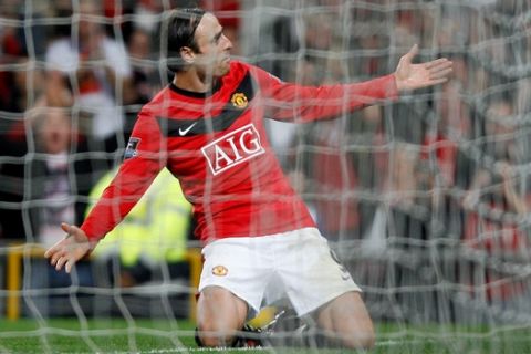 Manchester United's Dimitar Berbatov celebrates scoring his team's opening goal during their English Premier League soccer match against  Blackburn Rovers at Old Trafford Stadium, Manchester, England, Saturday, Oct. 31, 2009. (AP Photo/Simon Dawson)**NO INTERNET/MOBILE USAGE WITHOUT FOOTBALL ASSOCIATION PREMIER LEAGUE (FAPL) LICENCE. CALL +44 (0) 20 7864 9121 or EMAIL info@football-datco.com FOR DETAILS **