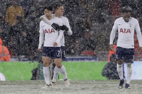 Tottenham Hotspur's Son Heung-ming, left, celebrates with teammates after scoring his sides 5th goal during the English FA Cup fifth round replay soccer match between Tottenham Hotspur and Rochdale at Wembley stadium in London, Wednesday, Feb. 28, 2018. (AP Photo/Matt Dunham)