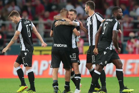 PAOK's players celebrate after the UEFA Champions League, third qualifying round, second leg soccer match between FC Spartak Moskva and PAOK FC at Spartak stadium in Moscow, Russia, Tuesday, Aug. 14, 2018. (AP Photo/Denis Tyrin)