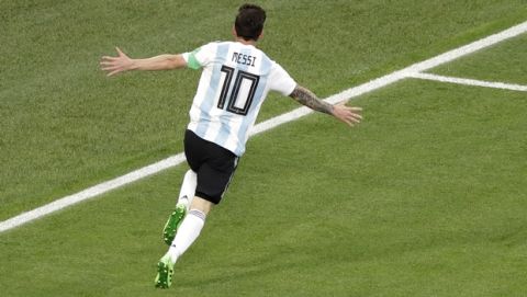 Argentina's Lionel Messi celebrates after scoring the opening goal during the group D match between Argentina and Nigeria, at the 2018 soccer World Cup in the St. Petersburg Stadium in St. Petersburg, Russia, Tuesday, June 26, 2018. (AP Photo/Michael Sohn)